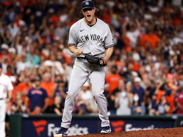 Jul 10, 2021; Houston, Texas, USA; New York Yankees starting pitcher Gerrit Cole (45) reacts after recording a strikeout against the Houston Astros to end the game at Minute Maid Park.